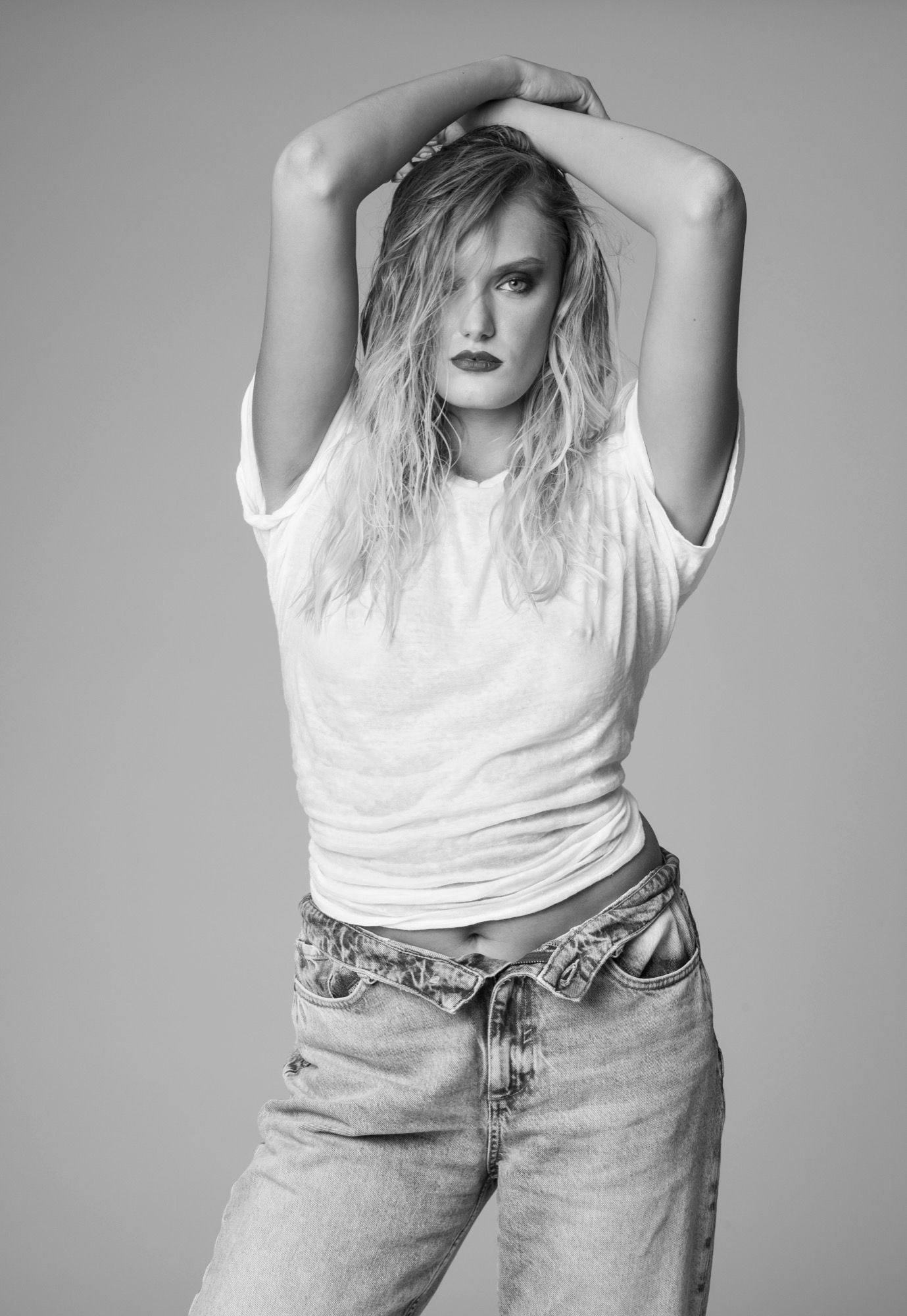 Portrait of a woman with long hair, black jacket, soft light in the studio (7)